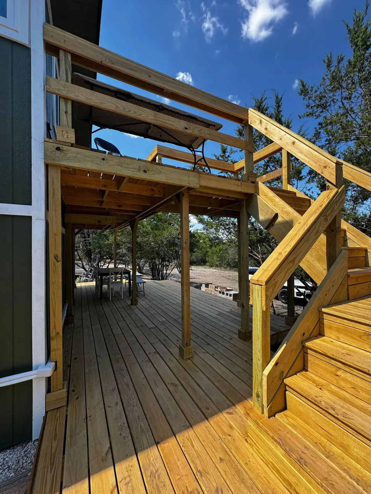 The outdoor staircase up to the balcony and the loft entrance
